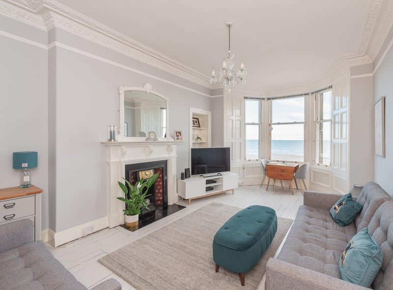 The living room has beautiful bay windows from which you can overlook the beach and take in the stunning sea views. It also has period features such as cornicing and a feature fireplace.