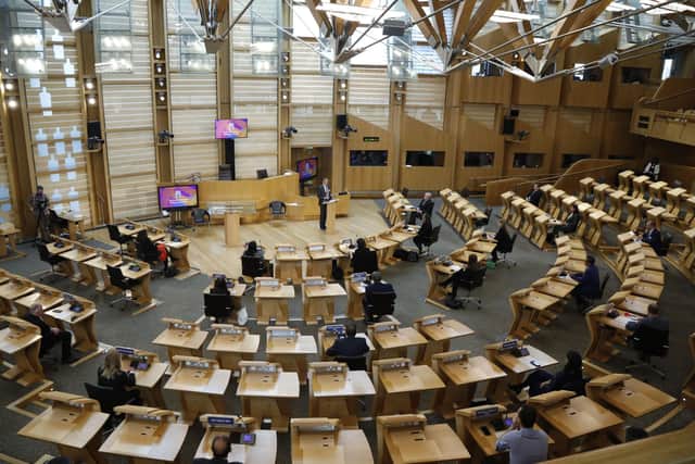 The Scottish Parliament's chamber was laid out in a semi-circle in the hope of making politics less confrontational (Picture: Andrew Cowan/pool/Getty Images)