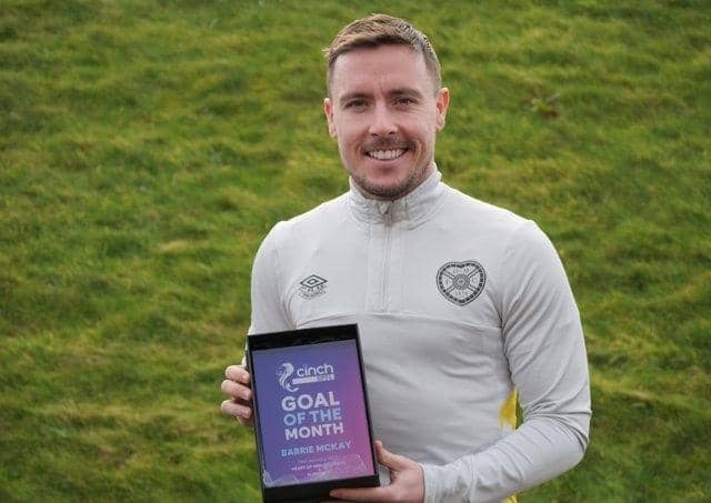 Hearts forward Barrie McKay with his Goal of the Month award. Pic: Heart of Midlothian FC