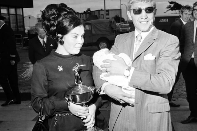 Boxer Ken Buchanan is greeted by his wife and baby when he arrives back in Edinburgh with his Gold Cup after beating Ismael Laguna	in San Juan to take the World Lightweight title in September 1970