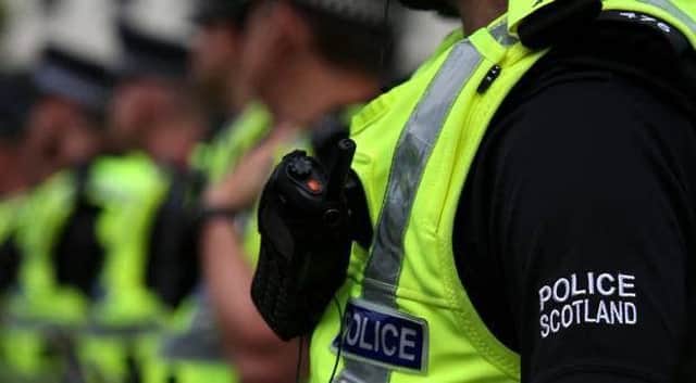 A stock image of Police Scotland. A man has been arrested following five cases of sexual assault reported in Edinburgh.