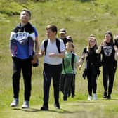 Pupils take part in a variety of activities: hillwalking, climbing wall, crate- stack, nightline and low ropes course. Sighthill Primary P7 pupils taking part in hillwalking.
