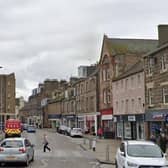 Emergency services rushed to Dalkeith High Street on Friday after a man jumped from a flat.