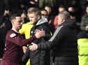 Barrie McKay shakes hands with Celtic manager Ange Postecoglou. The hearts forward had a quiet game. Picture: Rob Casey / SNS