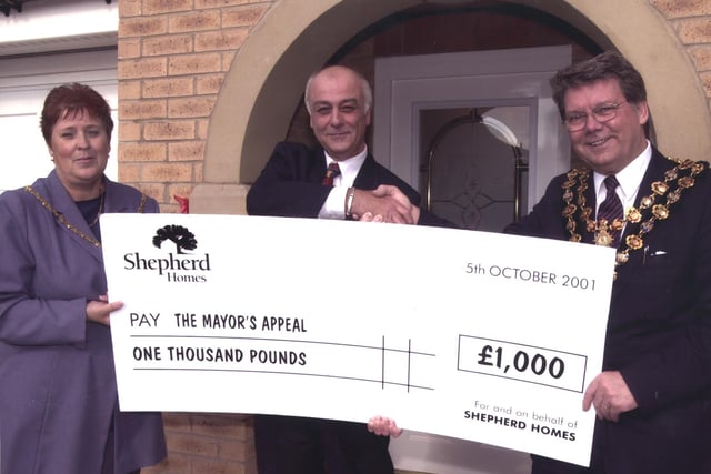The mayor of Chesterfield, councillor Jim McManus (right in picture) received a giant cheque for £1,000 towards the Mayor's Charity, Ashgate Hospice's ABC Appeal, from the managing Director of Shepherd Homes, Carol McManus in 2001