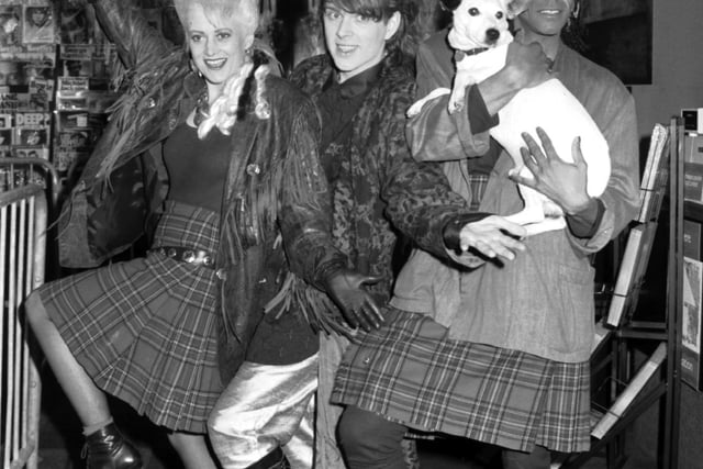 Pop stars Alana Currie and Joe Leeway in kilts with Tom Bailey (The Thompson Twins) and a Nipper the dog lookalike, when they opened the new HMV music store in Princes Street, Edinburgh, October 1985.