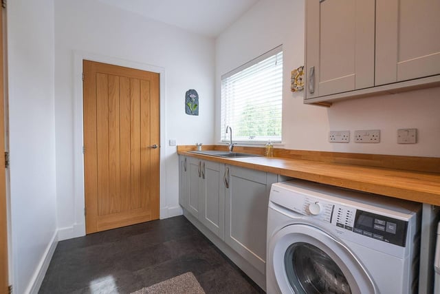 Laundry facilities are in an attached utility room on the ground floor which also provides further storage and worksurface space.