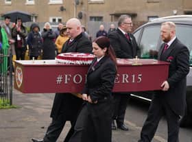 The coffin is carried into the church at the funeral of Andrew MacKinnon at St David's Broomhouse Parish Church, Edinburgh. 
Photo: Andrew Milligan/PA Wire
