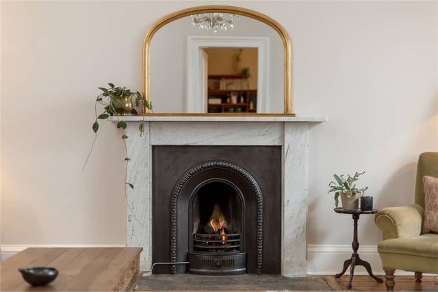 The sitting room has a feature fireplace with newly installed gas fire.