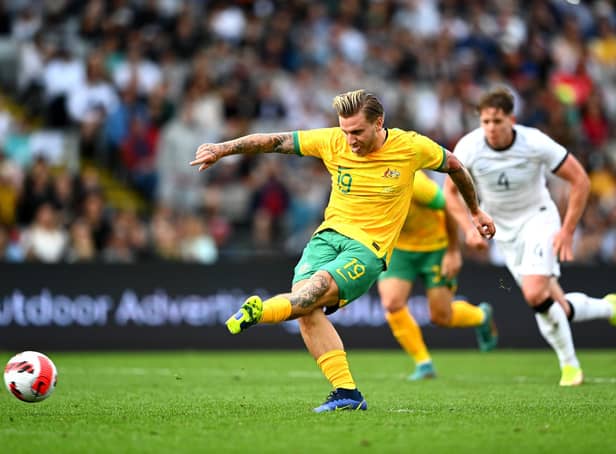Jason Cummings scores from the spot on his debut for Australia against New Zealand at Eden Park, Auckland. Picture: Hannah Peters/Getty Images