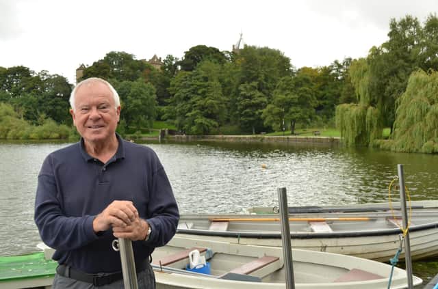 Tom Lambert on the pontoon at Linlithgow Loch with Linlithgow Palace in the trees behind him. Picture by Nigel Duncan