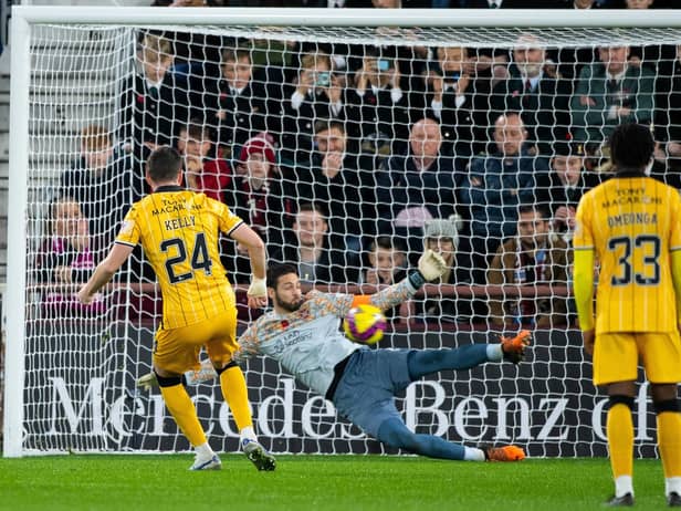 Craig Gordon saves a penalty from Livingston's Sean Kelly, keeping Hearts in the match and setting up a grandstand finish. Picture: SNS