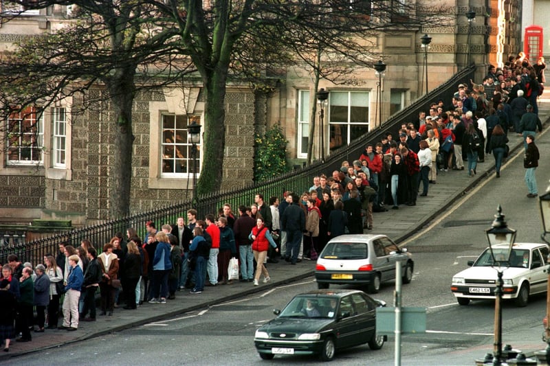 Edinburgh's Hogmanay Street Party was in high demand in 1997, with locals joining a long queue to secure tickets.