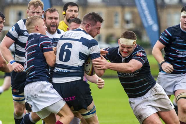 The Watsonians defence doubles up on Ruairidh Leishman as the Heriot’s back row stands firm. Picture: Lisa Ferguson