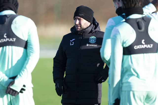 Johnson speaks to his squad during a training session at HTC