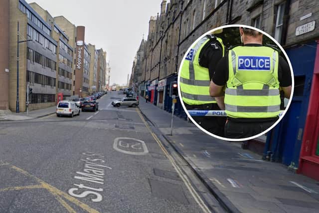 Police were called to St Mary's Street in Edinburgh's Old Town, after a man was spotted climbing scaffolding.