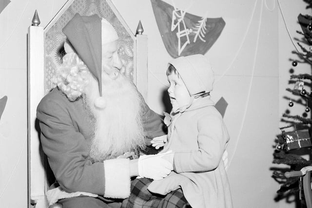 One little girl looked apprehensive as she met Father Christmas in Patrick Thomson's department store in Edinburgh.