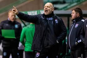 John Hughes was delighted with Ross County's win at Easter Road. Picture: SNS