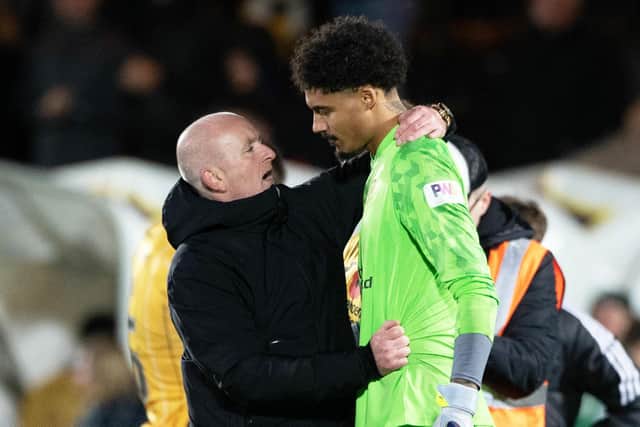 Livingston manager David Martindale embraces Shamal George at full time after the goalkeeper's fantastic performance. Picture: Paul Devlin / SNS