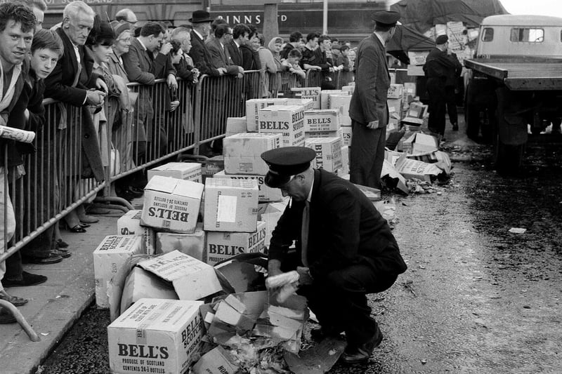 Lorries spill their load of Bell's whisky outside Binns department store at the West End of Princes Street Edinburgh in the 1960s. Binns is now of course rather ironically the home of the Johnnie Walker Whisky experience attraction.