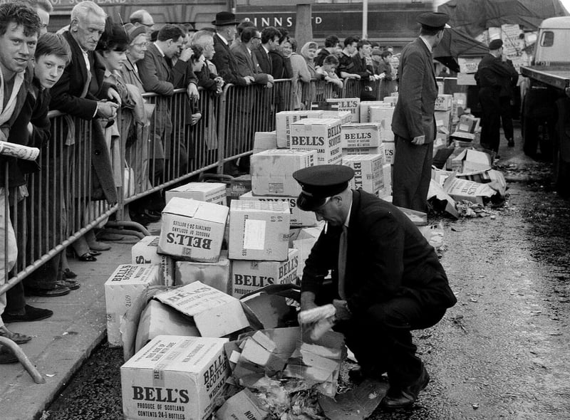Lorries spill their load of Bell's whisky outside Binns department store at the West End of Princes Street Edinburgh in the 1960s. Binns is now of course rather ironically the home of the Johnnie Walker Whisky experience attraction.
