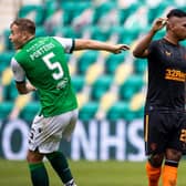 Ryan Porteous and Alfredo Morelos clash during the Hibs-Rangers match at Easter Road.