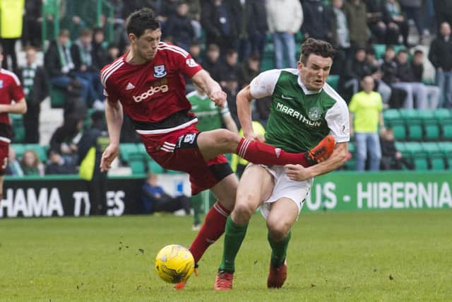 Scott McKenna fouls Hibs' John McGinn in a Scottish Cup game in 2017, reducing visitors Ayr United to ten men. Picture: SNS