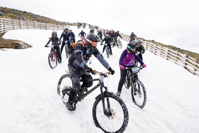 Following an arduous climb up the mountain, which reaches 1,221 metres, riders started in deep snow at the beginning of the route.