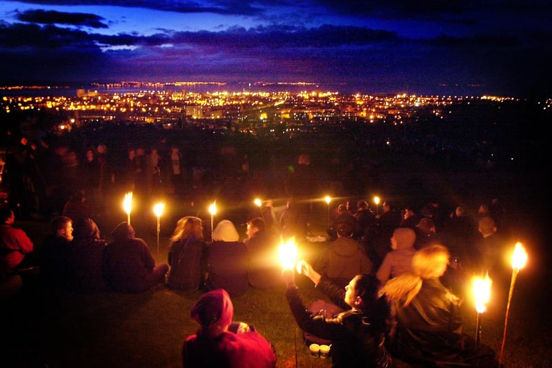 A view down on the lights of Leith from the top of Calton Hill during the 2001 Beltane fire festival.