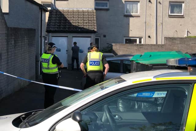 Police are dealing with an ongoing incident after a man died in a property in North Bughtlin Brae