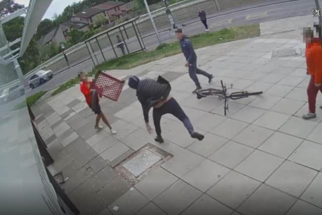 A group of youths were captured on CCTV attacking the man.