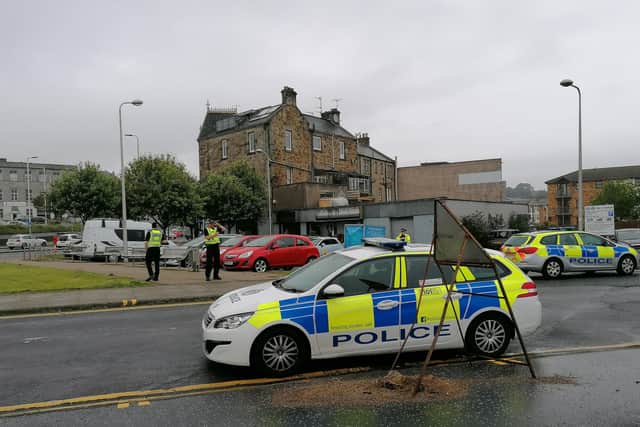 Police seal off the St James Street car park at the  harbour in Kirkcaldy shortly before lunchtime.