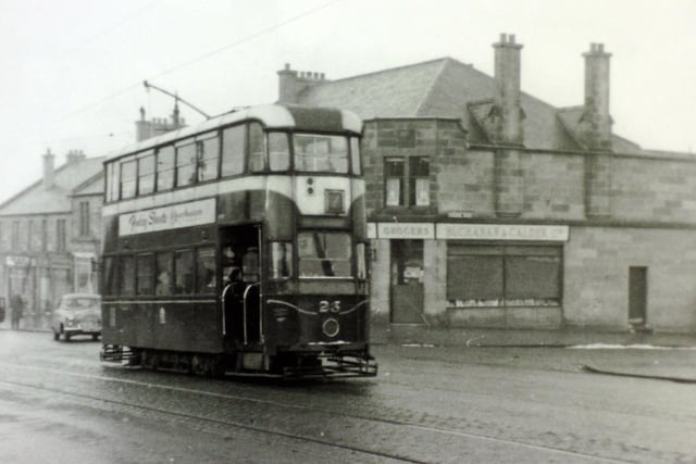 Up Liberton Brae, on 18 February 1956, car 23 on service No. 7 passes the shops at the junction with Wolrige Road.