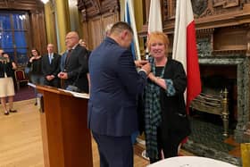 Ms Grahame being awarded the medal by the Consul General of the Republic of Poland in Edinburgh, Mr Łukasz Lutostański, at an event earlier this month at Edinburgh City Chambers to mark Polish National Day.