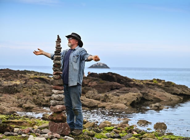 Enthusiasts take part in the European Stone Stacking Championships on July 10, 2021, in Dunbar, Scotland. The championships now in its fifth year, is Europe's largest championships for all Stone Stacking and Rock Balancing enthusiasts and artists. (Photo by Jeff J Mitchell/Getty Images)