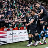 The Hibs players celebrate in front of the away fans at Livingston after going 3-1 up on Saturday. Picture: SNS