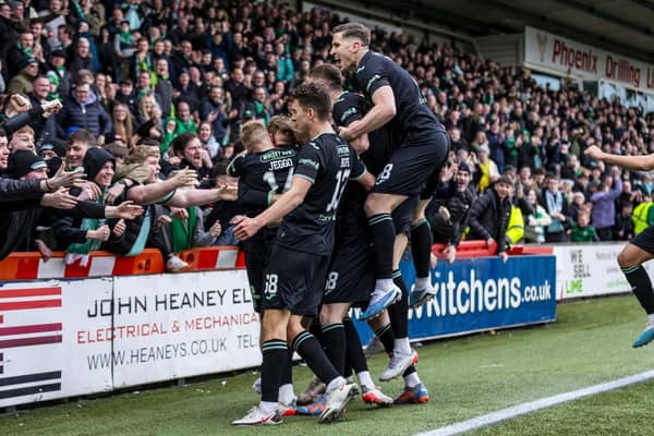 The Hibs players celebrate in front of the away fans at Livingston after going 3-1 up on Saturday. Picture: SNS