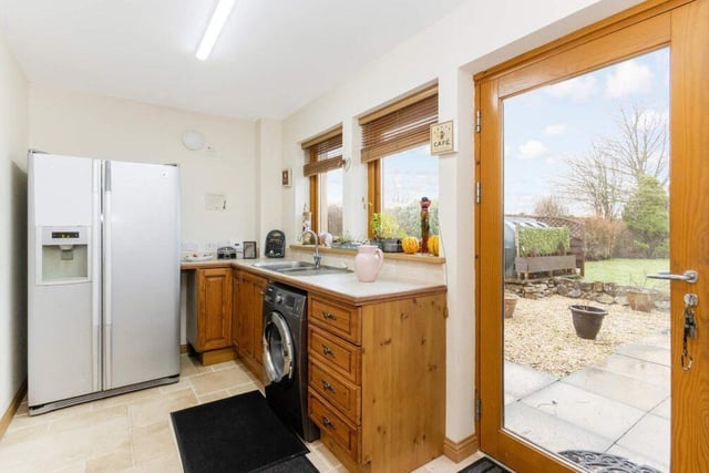 A handy utility room is situated off the kitchen, with access to the integral garage.