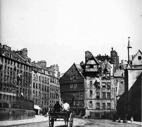 A horse and cart trundles towards Bowhead House and the Lawnmarket in the Old Town.