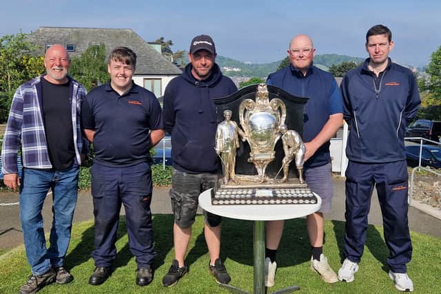 Head greenkeeper Gary Rodger, second right, and his Braids team pose with the historic Dispatch Trophy after coming off the course following their final prep work on Saturday morning. Picture: National World