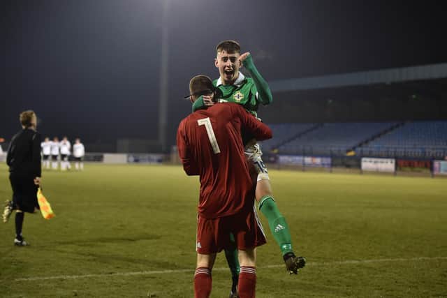 Darragh Burns, seen here celebrating victory in a penalty shoot-out for Northern Ireland U19s, has been linked with Hibs