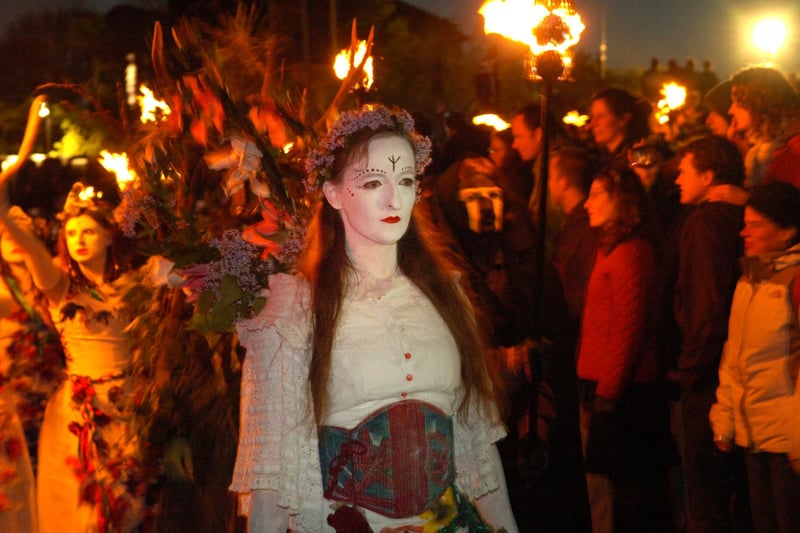 The May Queen and her White Warrior Women take part in the procession around Calton Hill at the 2007 Beltane fire festival.