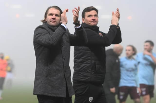 Hearts manager Robbie Neilson and assistant Lee McCulloch applaud the Hearts fans.