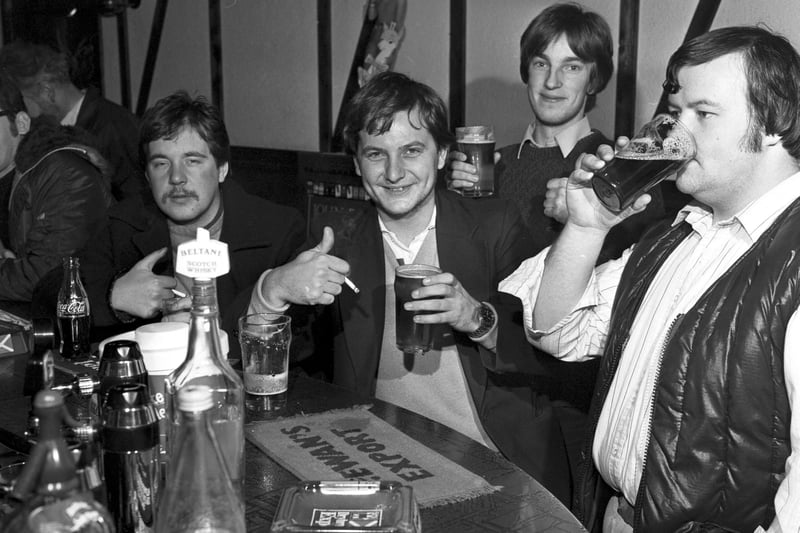 Men from the night shift at the Ferranti factory enjoy an early morning pint of beer at The Cavern pub in leith, November 1981.