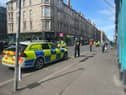 Police descended on Easter Road after a car hit a pedestrian in the Leith area of Edinburgh.