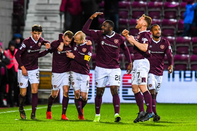 The Hearts players left the Hearts fans delighted after their win over Rangers. Picture: SNS