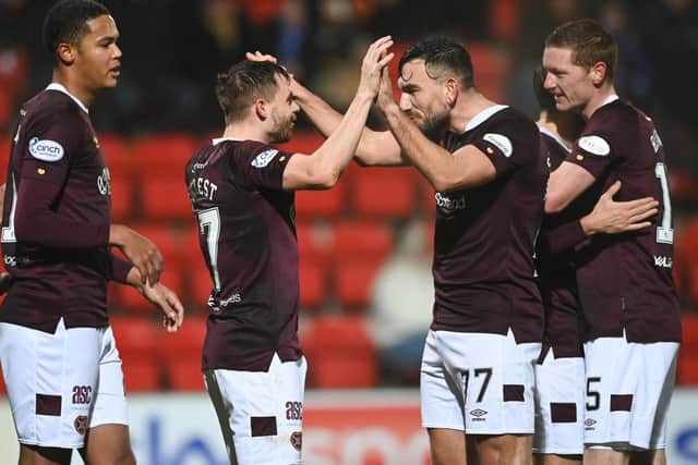 Robert Snodgrass (middle right) congratulates Alan Forrest after scoring in Hearts' 3-2 win over St Johnstone in late December. Picture: SNS