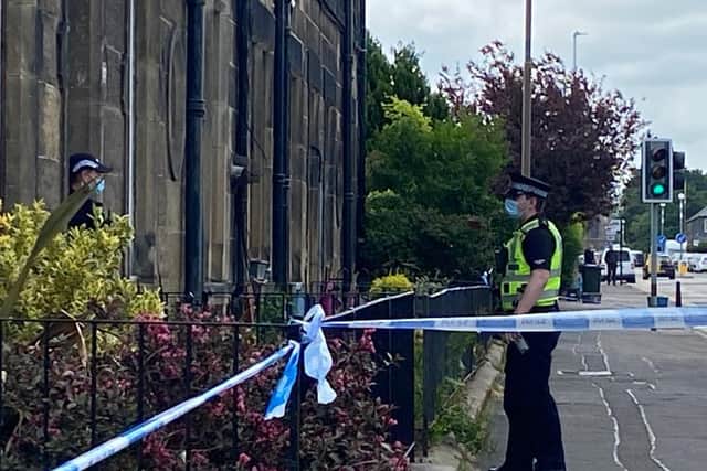 Police outside a property in Granton Road on Tuesday. Pic: Lisa Ferguson