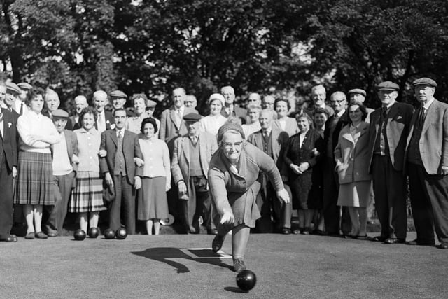 Many people still enjoy bowling at The Meadows and here we can see Mrs G Bews take her shot in a match at the west end of The Meadows. Year: 1963.