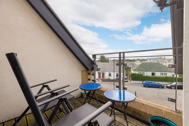 The top floor property has this wonderful roof terrace, offering a tranquil space to sit and watch the world go by.